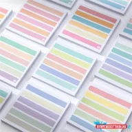 Színes sorokkal ellátott öntapadós jegyzettömb